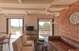 Living room with fireplace - Villa Niellucciu at Tarra di Sognu Estate in Figari