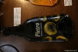 Abgeflachte Pietra-Flasche aus Glas - Atraverre Calvi, Korsika