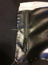 Complete refurbishment of the Skaï parts, the collar and the zipped piped pockets