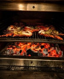 Aragoste alla griglia cotte al fuoco di legna - Ristorante Chez Marc a Centuri