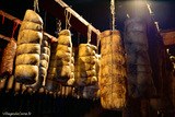 Coppas hanging in the aging room, Battaglia charcuterie in Vallecalle