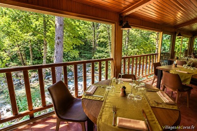 Restaurant dining room by the river - Auberge de la Restonica in Corte
