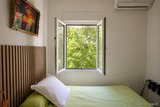 Room with nature view and open window - Au Bon Clocher Hotel in Canari
