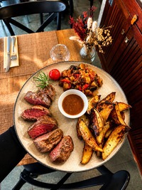 Grilled beef steak and homemade side dish - Au Bon Clocher Restaurant in Canari