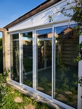 Véranda aluminium blanche avec baies vitrées - Extension lumineuse réalisée par AIP à Vescovato