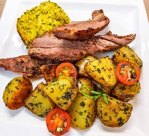 Corsican meat served with roasted potatoes.
