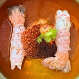 Scampi semicotti in brodo di zafferano con tuile di olive nere salate - Ristorante U Palmentu - Centuri, Corsica